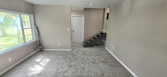 1835 Echo Point Rd, Bronston, KY 42518 - unfurnished room with carpet floors, baseboards, and stairway