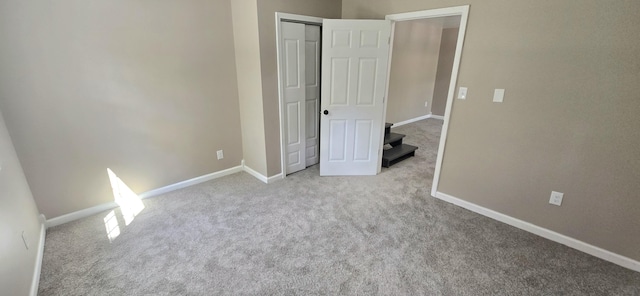 1835 Echo Point Rd, Bronston, KY 42518 - unfurnished bedroom with carpet, baseboards, and a closet