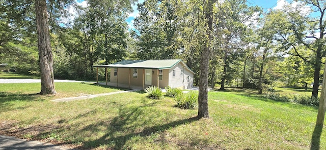 view of yard with covered porch