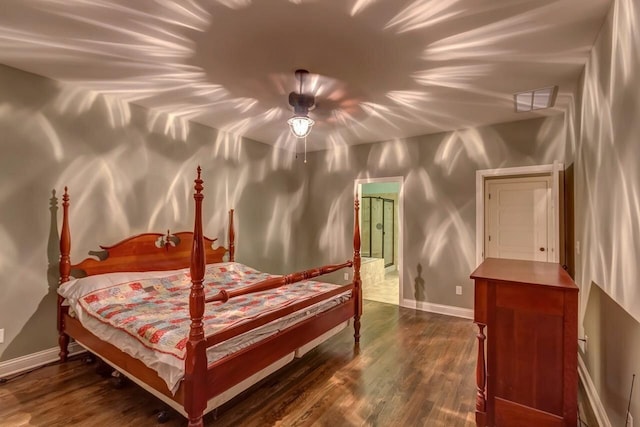 bedroom featuring ceiling fan and dark wood-type flooring