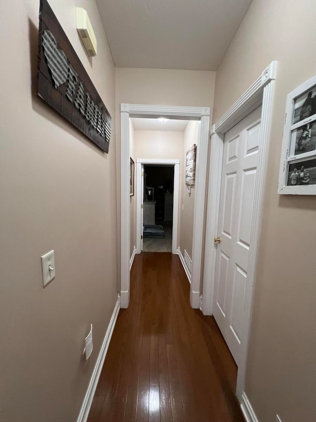 hallway featuring dark hardwood / wood-style floors