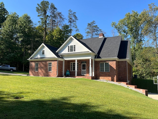 view of front facade with a front lawn and covered porch