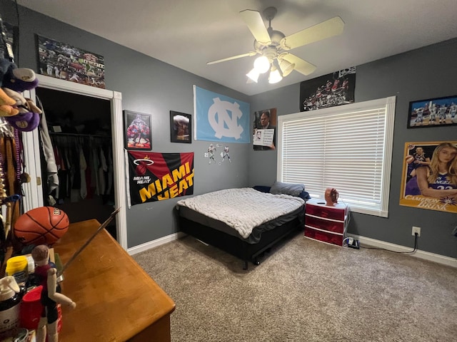 bedroom featuring carpet flooring, ceiling fan, and a closet