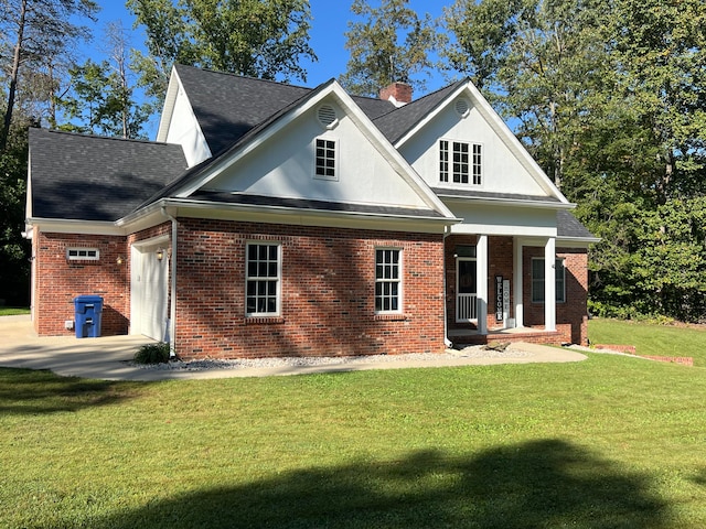 rear view of house featuring a porch and a lawn