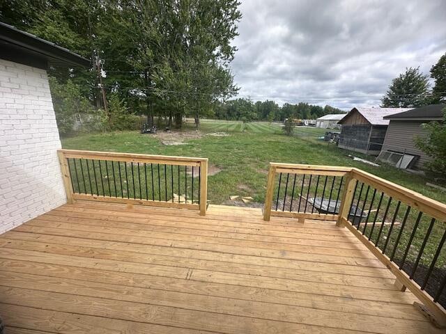 deck featuring a yard