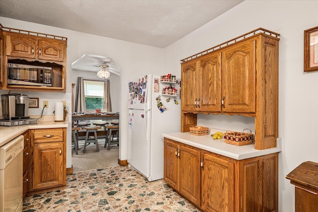 15 Oak Leaf Ln, Albany, KY 42602 - kitchen featuring light colored carpet, ceiling fan, white appliances, and a textured ceiling