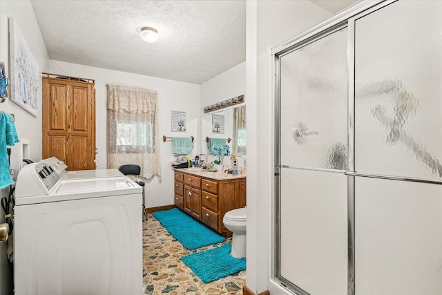 15 Oak Leaf Ln, Albany, KY 42602 - bathroom with vanity, walk in shower, washer and dryer, toilet, and a textured ceiling