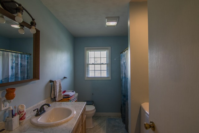 bathroom with vanity and toilet