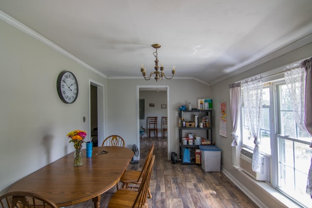 dining space featuring ornamental molding, a chandelier, dark hardwood / wood-style flooring, and a wealth of natural light