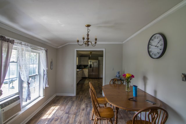 dining room with ornamental molding, a chandelier, plenty of natural light, and dark hardwood / wood-style flooring