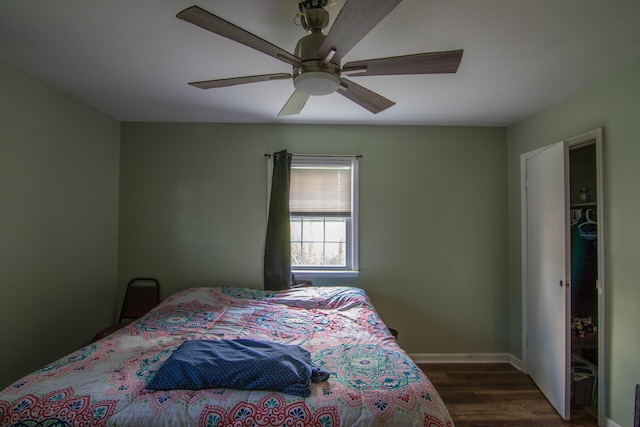 bedroom featuring ceiling fan and dark hardwood / wood-style flooring