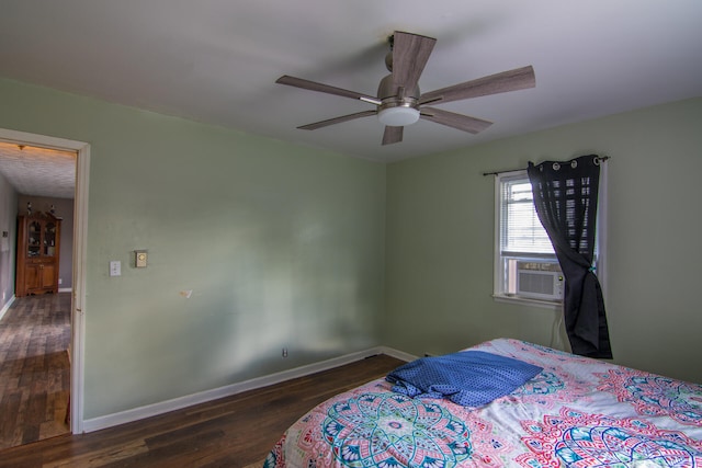 bedroom featuring dark hardwood / wood-style floors and ceiling fan