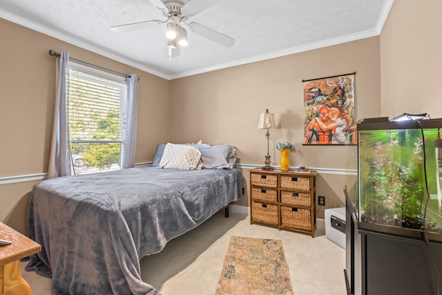 bedroom featuring ceiling fan, light colored carpet, a textured ceiling, and ornamental molding