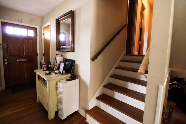 foyer entrance with dark hardwood / wood-style flooring