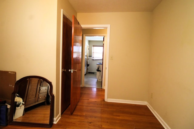 corridor featuring dark hardwood / wood-style floors