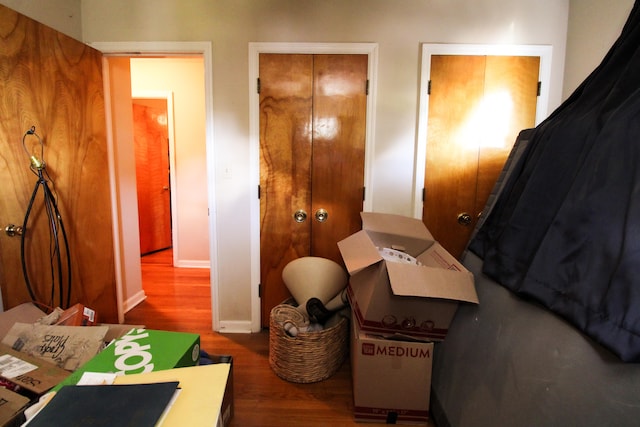 bedroom with dark hardwood / wood-style flooring