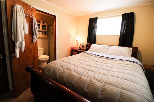 bedroom with ensuite bathroom, ornamental molding, and carpet