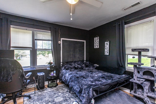 bedroom featuring hardwood / wood-style floors and ceiling fan