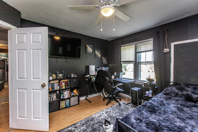 bedroom featuring ceiling fan and hardwood / wood-style floors