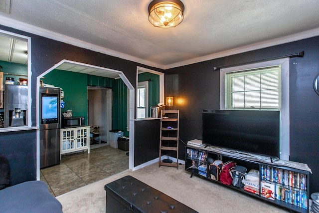 tiled living room featuring a textured ceiling and crown molding