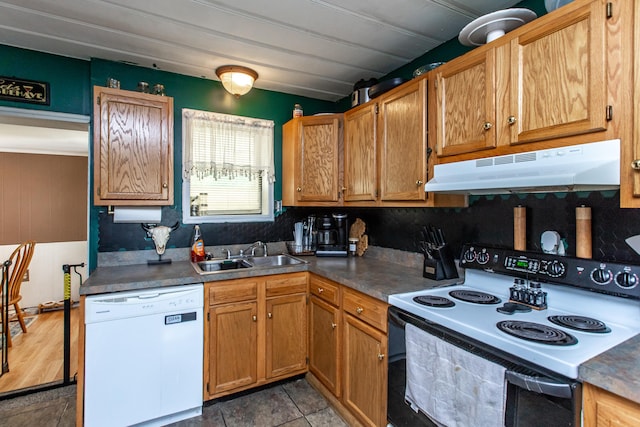 kitchen featuring dark hardwood / wood-style flooring, sink, white appliances, and decorative backsplash