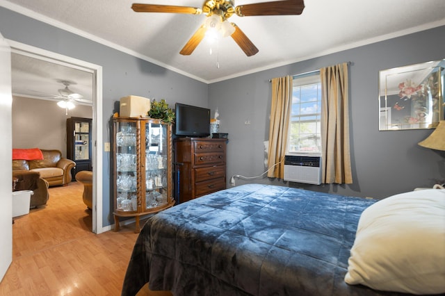 bedroom with wood-type flooring, ornamental molding, ceiling fan, and cooling unit