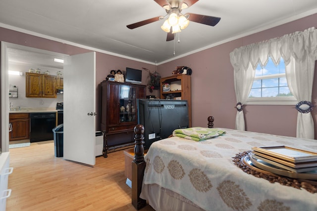 bedroom featuring light wood-type flooring, sink, ensuite bathroom, ornamental molding, and ceiling fan