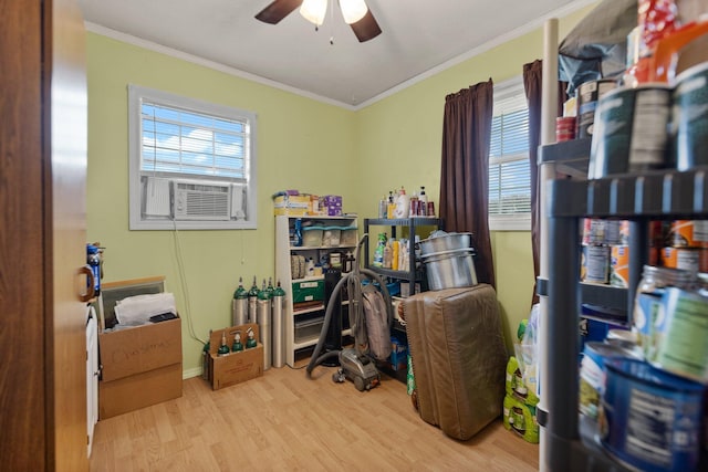 office space featuring ceiling fan, ornamental molding, cooling unit, and light hardwood / wood-style floors