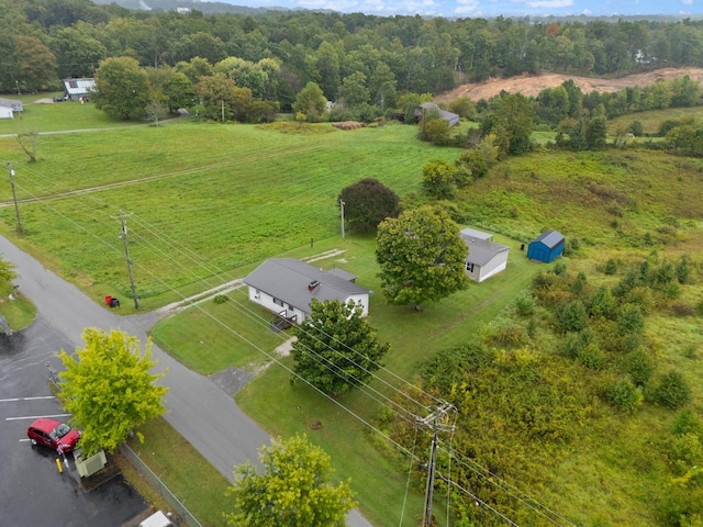 birds eye view of property featuring a rural view