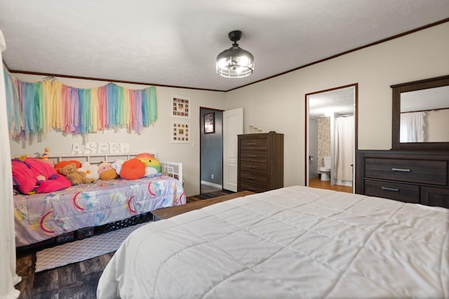 bedroom with a textured ceiling, dark hardwood / wood-style floors, and crown molding