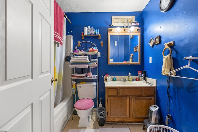 full bathroom featuring vanity, shower / bath combo, toilet, and tile patterned floors