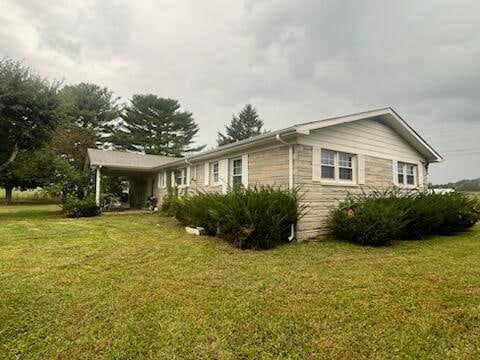 view of home's exterior featuring a yard