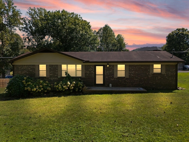 ranch-style house with a yard