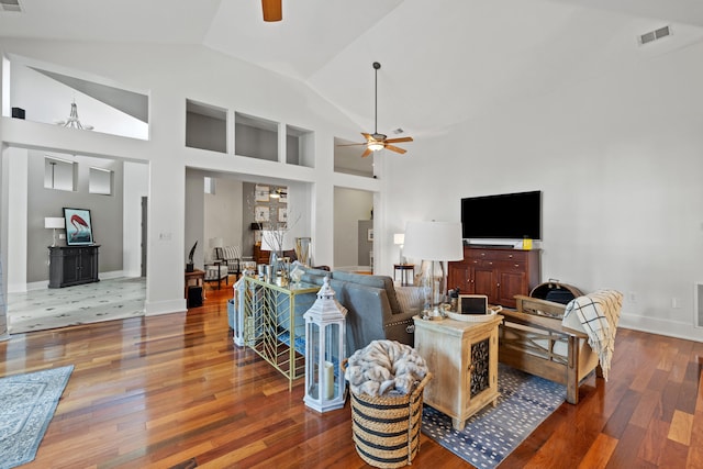 living room featuring hardwood / wood-style floors, ceiling fan, and high vaulted ceiling