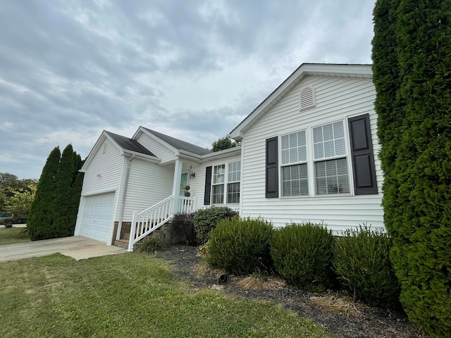 view of front facade with a front yard and a garage