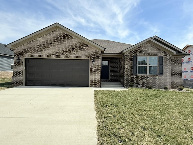 ranch-style house featuring a front yard, driveway, roof with shingles, an attached garage, and brick siding