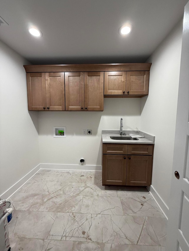 clothes washing area with baseboards, electric dryer hookup, washer hookup, a sink, and marble finish floor