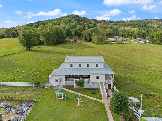 birds eye view of property featuring a rural view