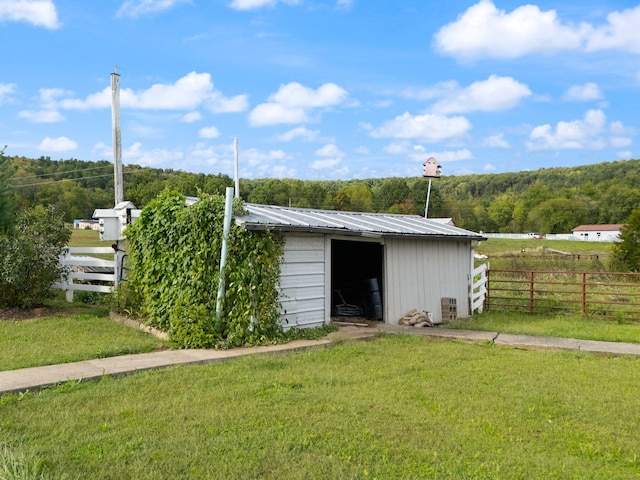 view of outbuilding featuring a yard