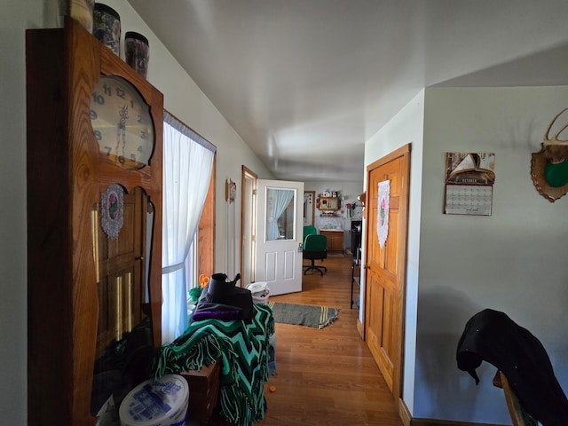 hall with hardwood / wood-style floors