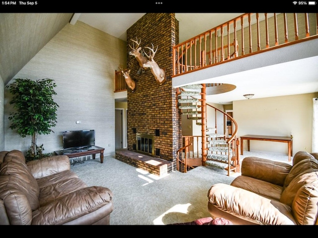 living room with a brick fireplace, carpet floors, beam ceiling, and high vaulted ceiling