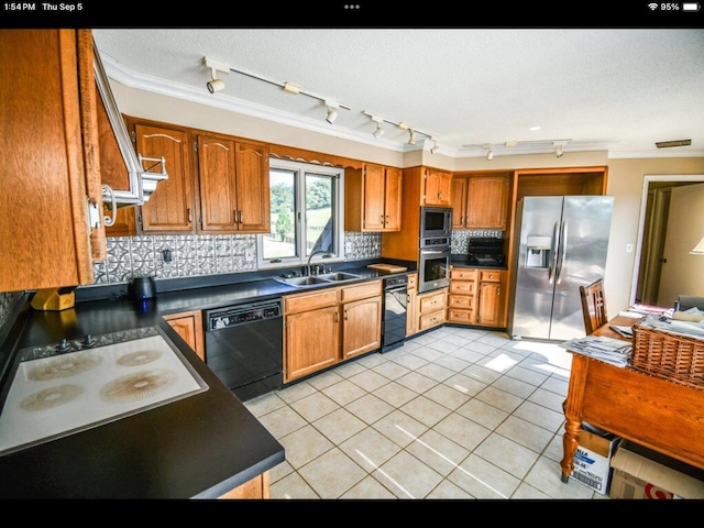 kitchen featuring sink, stainless steel appliances, backsplash, light tile patterned floors, and ornamental molding