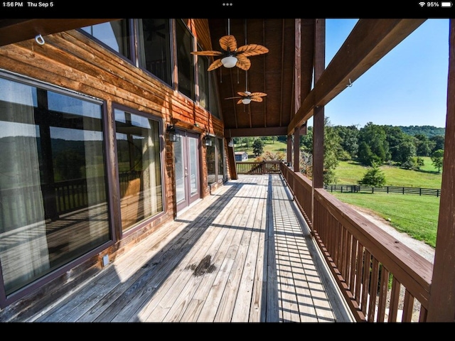 wooden deck with ceiling fan