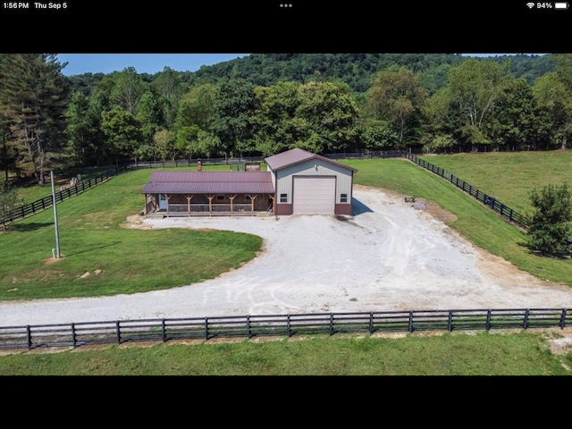 birds eye view of property featuring a rural view