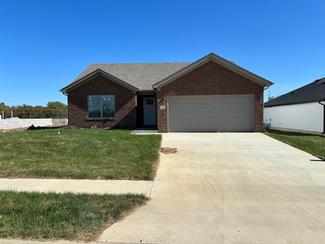 ranch-style home featuring a front yard and a garage