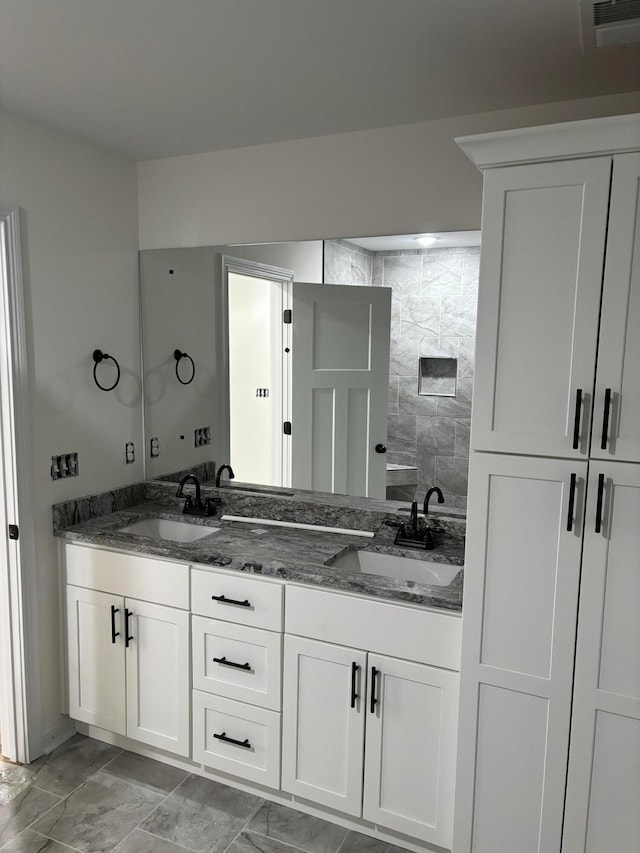 bathroom with vanity and walk in shower