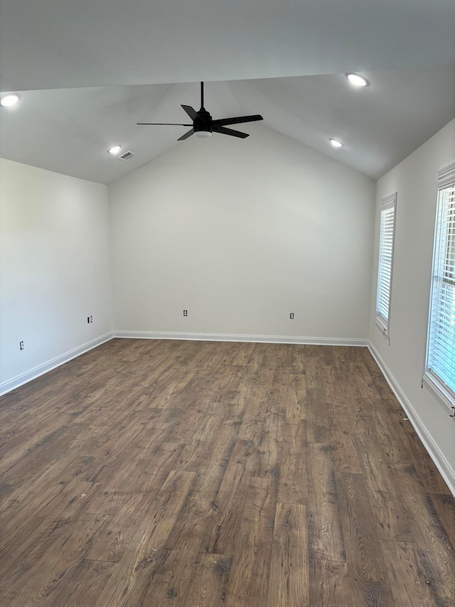 unfurnished room with lofted ceiling, dark wood-type flooring, and ceiling fan