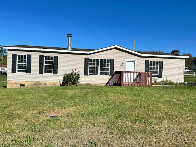 rear view of house with a lawn