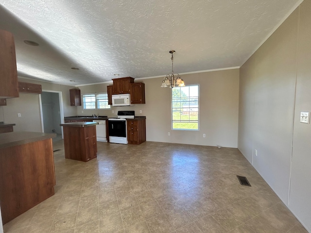 kitchen featuring crown molding, decorative light fixtures, a chandelier, a textured ceiling, and white appliances