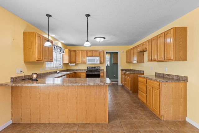 kitchen with black electric range, dark tile patterned flooring, sink, kitchen peninsula, and decorative light fixtures